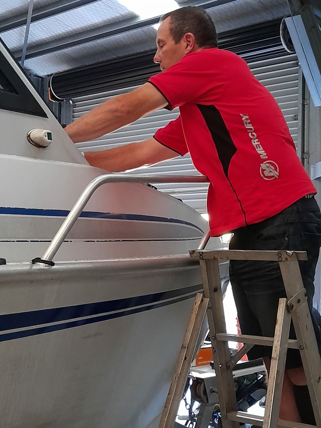 BSM technician working on a boat hull in the workshop
